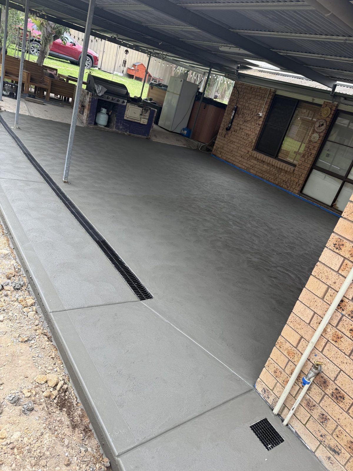 Plain concrete carport slab by EAB Concreting, Hunter Valley