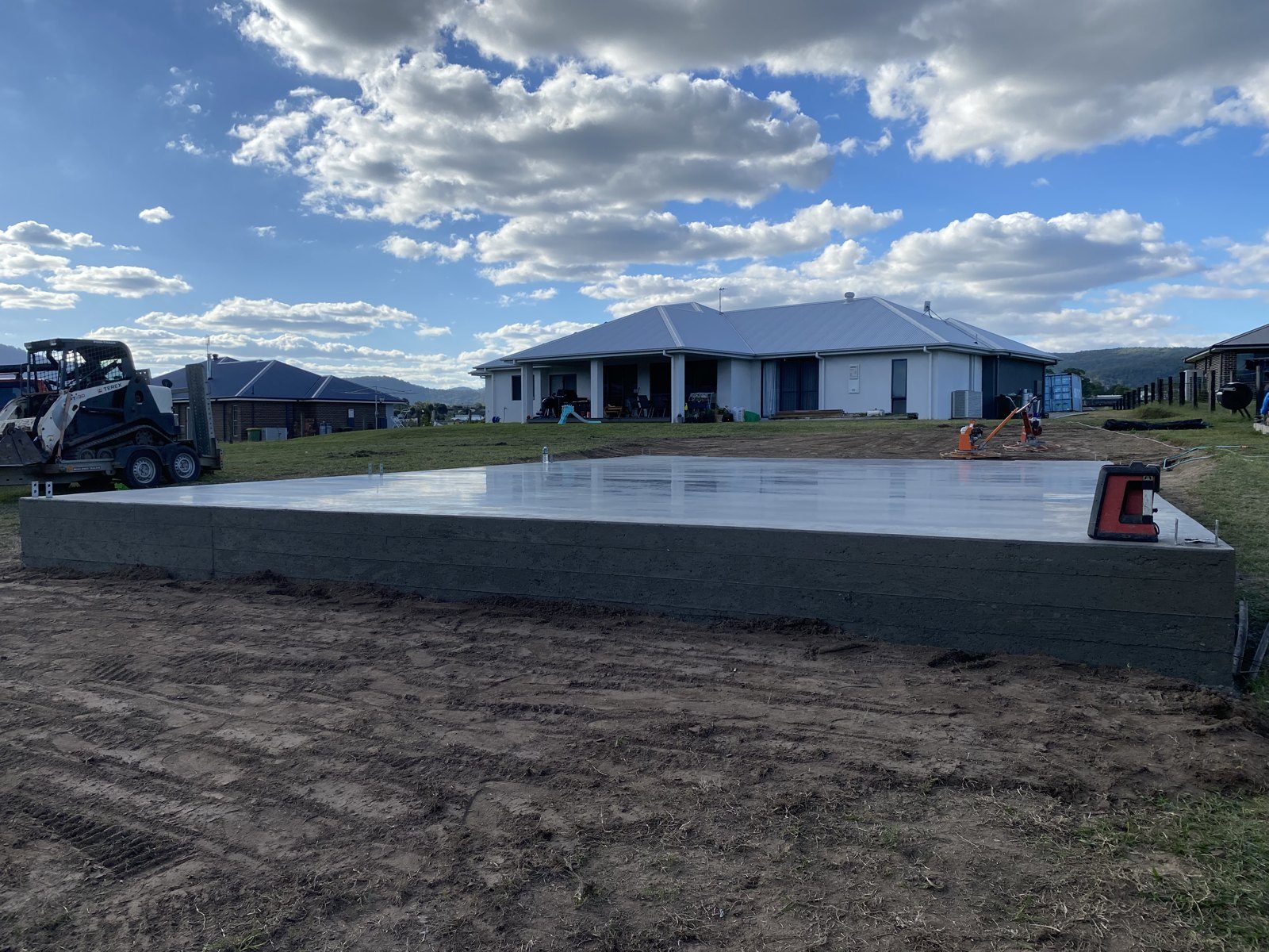 Raised concrete slab site with excavation machinery by EAB Concreting, Hunter Valley