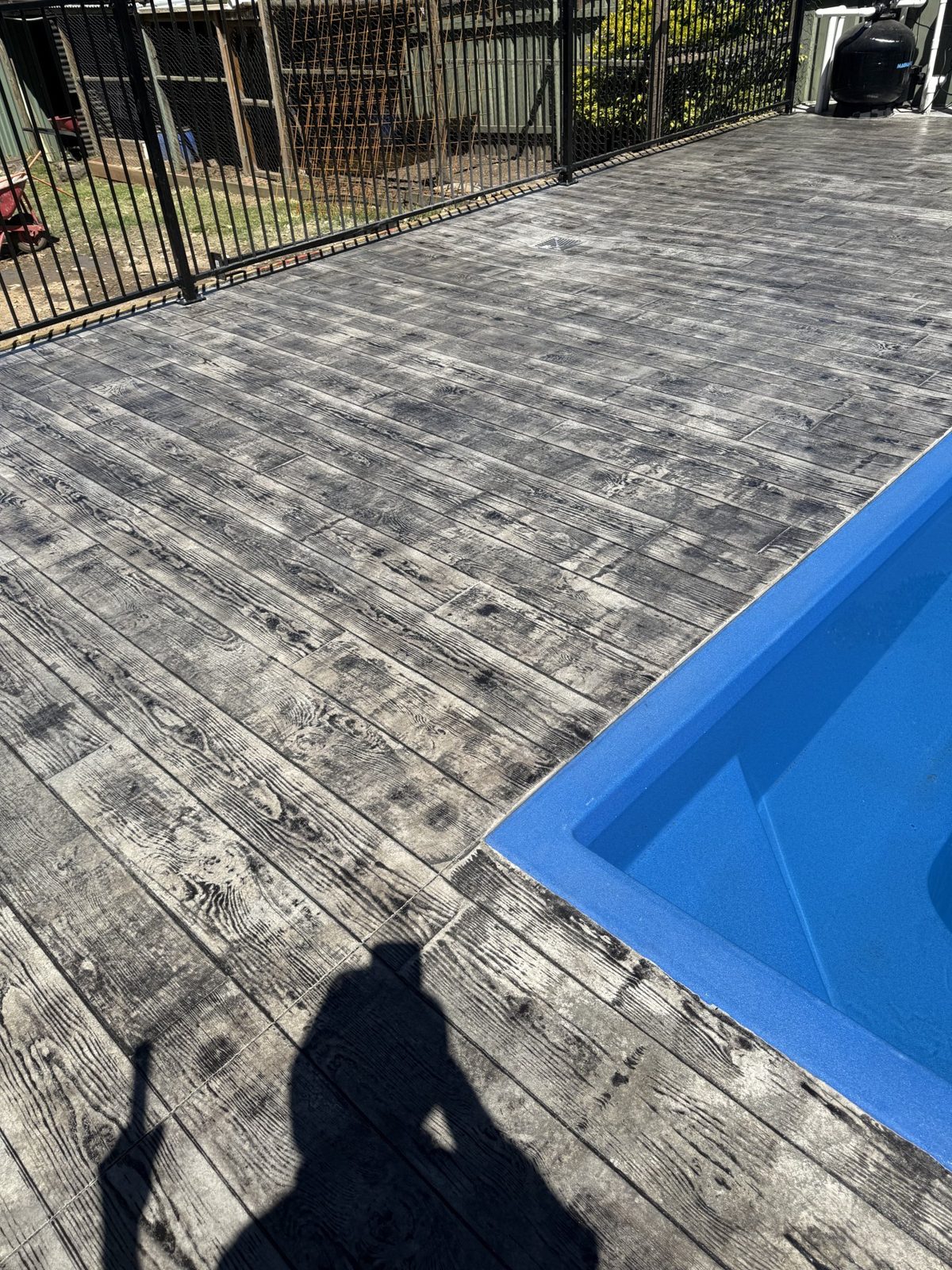 Timber-look stamped concrete pool surround by EAB Concreting, Hunter Valley